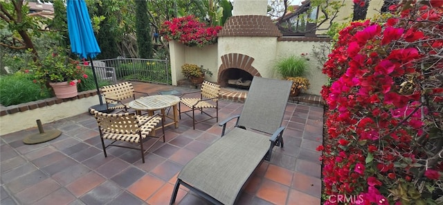 1364 Park Plaza Dr, Long Beach, CA 90804 - view of patio with an outdoor brick fireplace