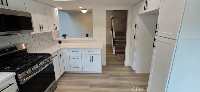 1364 Park Plaza Dr, Long Beach, CA 90804 - kitchen featuring appliances with stainless steel finishes, recessed lighting, light wood-type flooring, light countertops, and backsplash