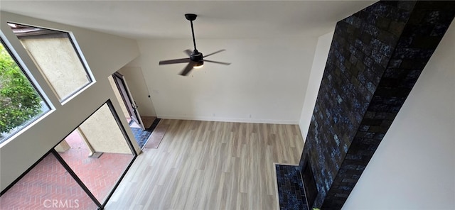 1364 Park Plaza Dr, Long Beach, CA 90804 - unfurnished living room featuring wood finished floors, ceiling fan, lofted ceiling, and baseboards