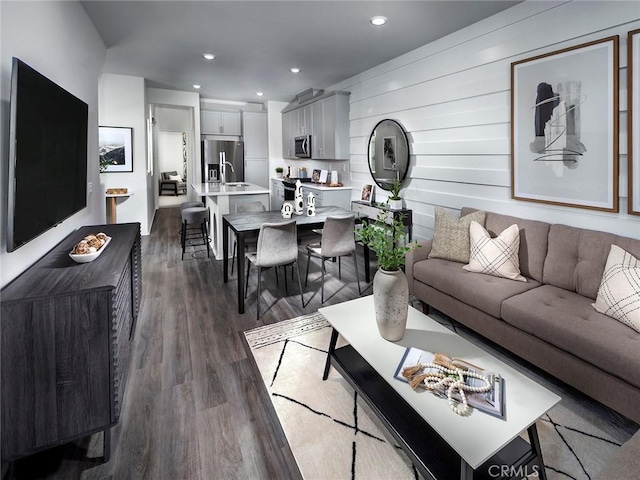 209 Aurora Ln, Pomona, CA 91767 - living area with dark wood-style floors and recessed lighting