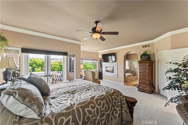 16 Via Barcaza, Coto De Caza, CA 92679 - carpeted bedroom featuring access to outside, french doors, arched walkways, crown molding, and ensuite bathroom