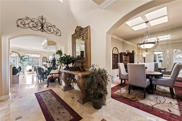 16 Via Barcaza, Coto De Caza, CA 92679 - dining room with arched walkways, ornamental molding, marble tiled floors, and a towering ceiling