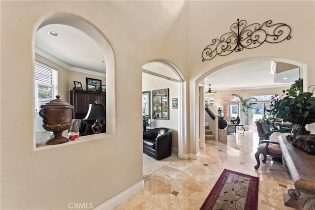 16 Via Barcaza, Coto De Caza, CA 92679 - foyer entrance featuring arched walkways, ornamental molding, a ceiling fan, marble finish floors, and stairway
