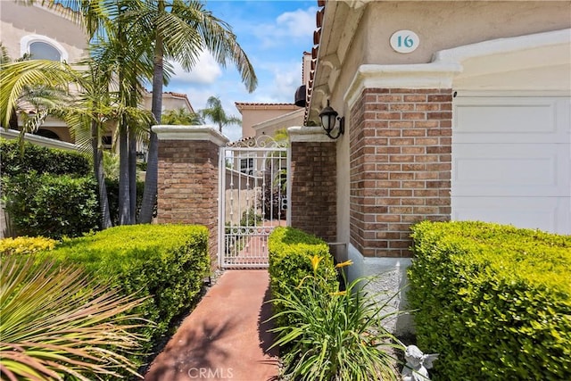 16 Via Barcaza, Coto De Caza, CA 92679 - entrance to property with brick siding and a gate
