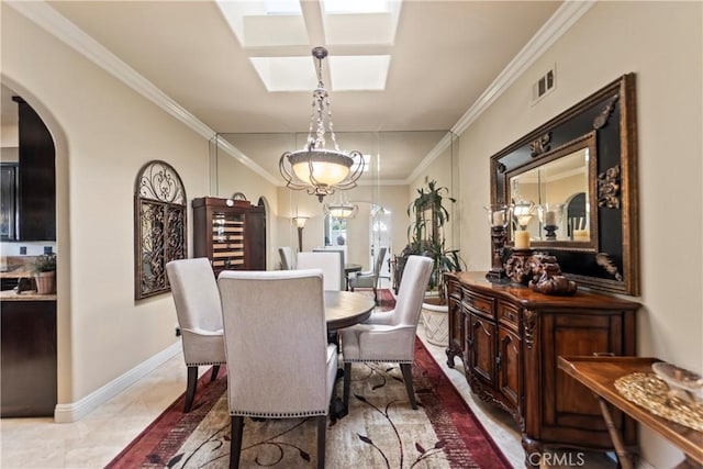 16 Via Barcaza, Coto De Caza, CA 92679 - dining room featuring crown molding, arched walkways, and a skylight