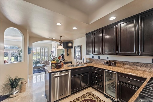 16 Via Barcaza, Coto De Caza, CA 92679 - kitchen with dishwasher, wine cooler, arched walkways, recessed lighting, and a peninsula