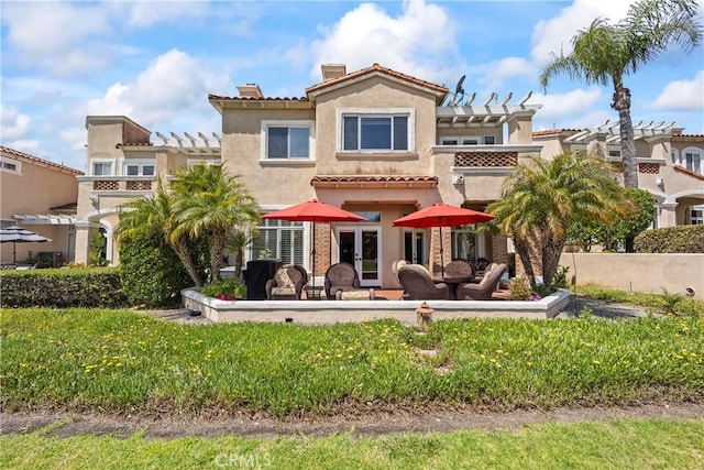 16 Via Barcaza, Coto De Caza, CA 92679 - rear view of house featuring a pergola, a chimney, stucco siding, and french doors