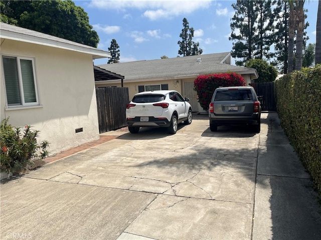 14782 Holt Ave, Tustin, CA 92780 - view of property exterior with concrete driveway, crawl space, and stucco siding