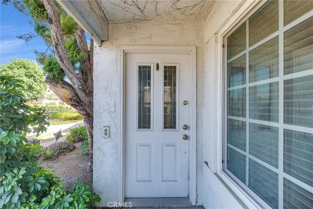 6765 Jadeite Ave, Rancho Cucamonga, CA 91701 - property entrance with stucco siding