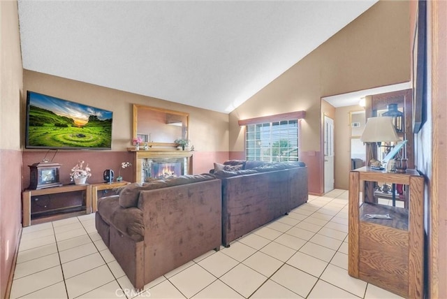 6765 Jadeite Ave, Rancho Cucamonga, CA 91701 - living area featuring light tile patterned floors, a glass covered fireplace, and high vaulted ceiling