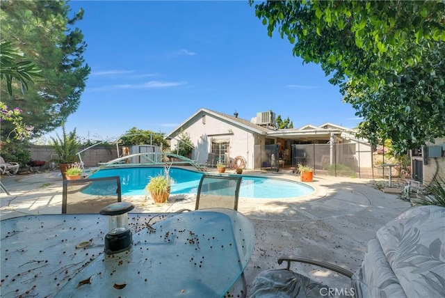 6765 Jadeite Ave, Rancho Cucamonga, CA 91701 - view of swimming pool featuring a fenced backyard, a patio area, and cooling unit