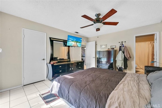 6765 Jadeite Ave, Rancho Cucamonga, CA 91701 - bedroom featuring a textured ceiling, light tile patterned floors, and a ceiling fan