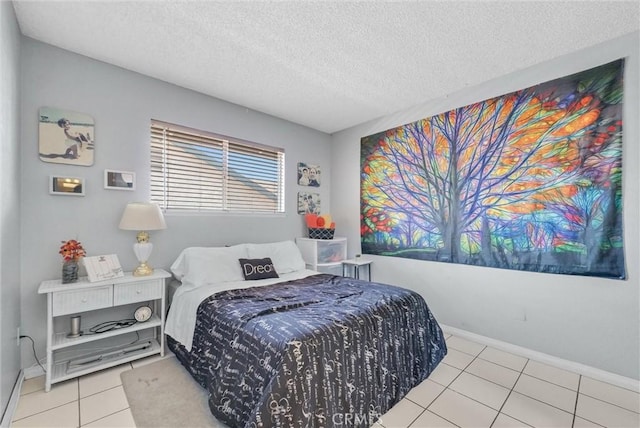 6765 Jadeite Ave, Rancho Cucamonga, CA 91701 - bedroom featuring a textured ceiling, tile patterned flooring, and baseboards