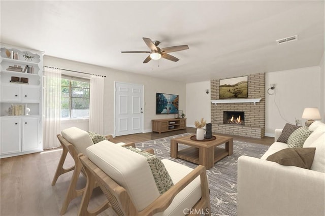 124 S Glengrove Ave, San Dimas, CA 91773 - living room featuring ceiling fan, wood finished floors, a fireplace, and baseboards