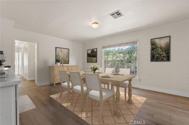 124 S Glengrove Ave, San Dimas, CA 91773 - dining room featuring baseboards and light wood-style flooring