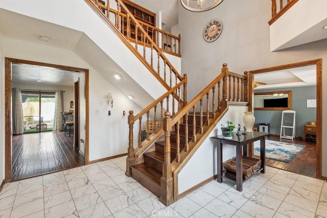6978 Withers Rd, Riverside, CA 92506 - stairs with marble finish flooring, baseboards, and a high ceiling