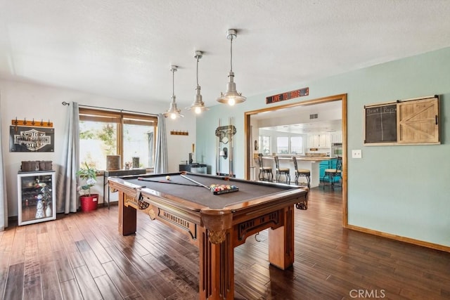 6978 Withers Rd, Riverside, CA 92506 - game room with beverage cooler, pool table, wood finished floors, baseboards, and a textured ceiling