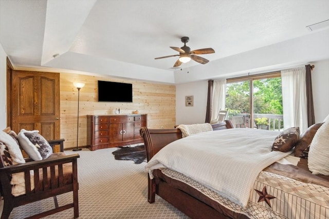 6978 Withers Rd, Riverside, CA 92506 - bedroom featuring wood walls, light carpet, a raised ceiling, a ceiling fan, and access to exterior