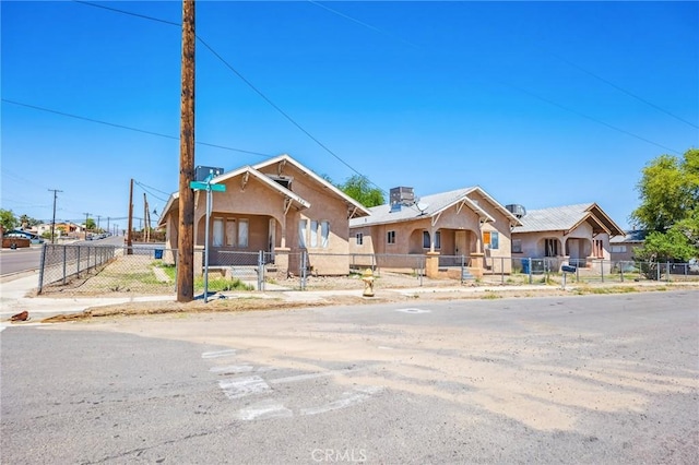 518 A St, Needles, CA 92363 - bungalow-style home featuring a fenced front yard and stucco siding