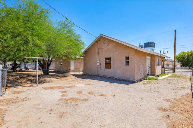 518 A St, Needles, CA 92363 - view of home's exterior featuring central AC unit and stucco siding
