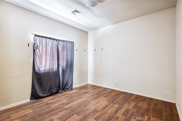518 A St, Needles, CA 92363 - empty room with wood finished floors and baseboards