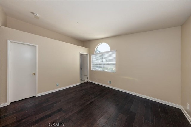2069 W Fairview Dr, Rialto, CA 92377 - unfurnished room with dark wood-style floors and baseboards