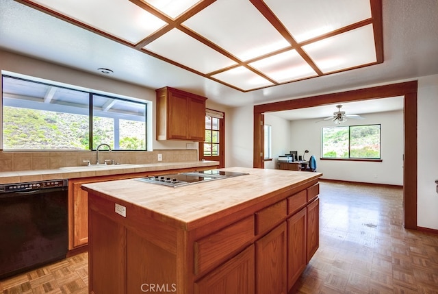 44196 La Cruz Dr, Temecula, CA 92590 - kitchen featuring black dishwasher, wood counters, electric stovetop, tasteful backsplash, and a center island