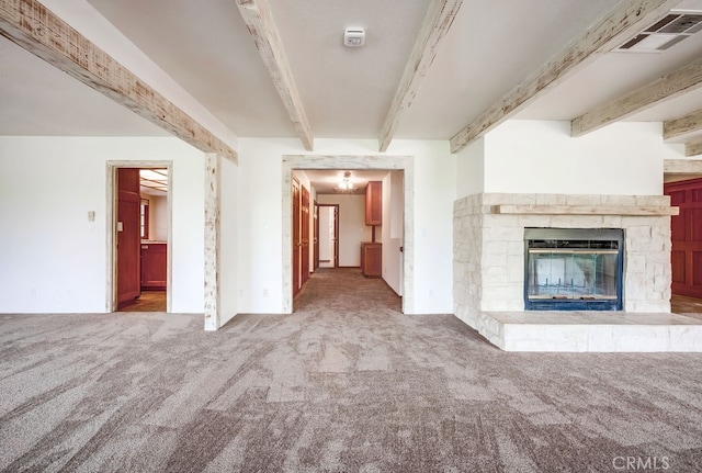 44196 La Cruz Dr, Temecula, CA 92590 - unfurnished living room featuring beam ceiling, carpet, and a stone fireplace