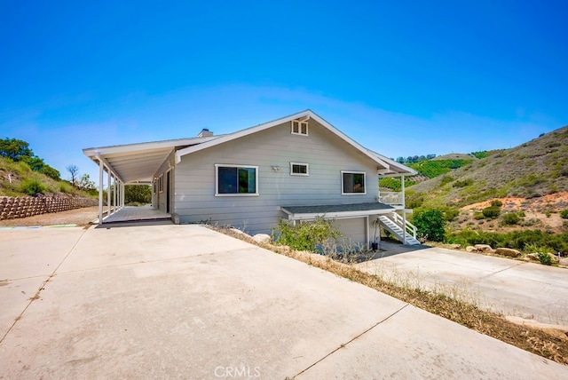 44196 La Cruz Dr, Temecula, CA 92590 - view of front of property featuring concrete driveway, a garage, stairway, and a carport