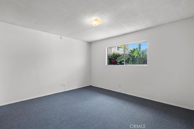 1646 W 168th St, Gardena, CA 90247 - unfurnished room with a textured ceiling, dark colored carpet, and baseboards