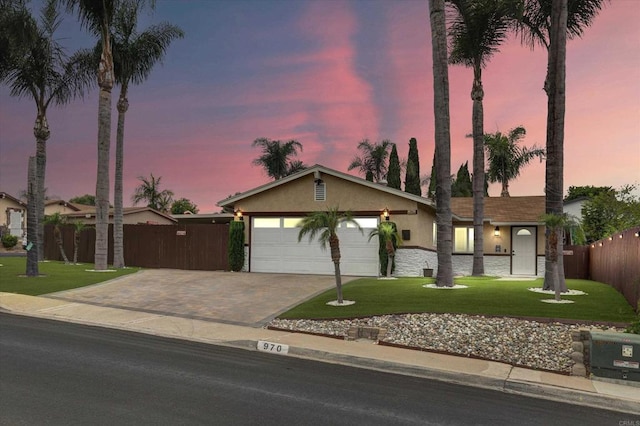 970 Carlsbad St, San Diego, CA 92114 - ranch-style house with driveway, an attached garage, stucco siding, and stone siding