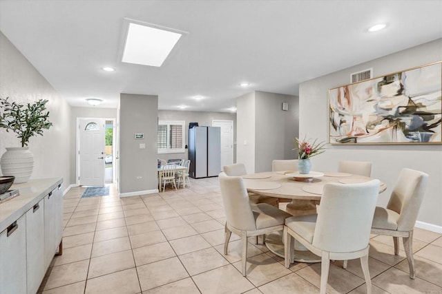 970 Carlsbad St, San Diego, CA 92114 - dining space featuring light tile patterned floors, recessed lighting, a skylight, and baseboards
