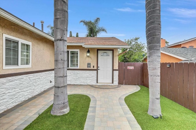970 Carlsbad St, San Diego, CA 92114 - view of exterior entry featuring stucco siding and stone siding