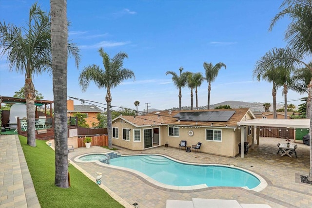 970 Carlsbad St, San Diego, CA 92114 - view of pool featuring a fenced backyard, a patio, a mountain view, and a pool with connected hot tub