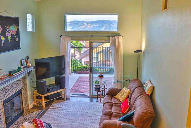 5787 Barbary Pl, Bonsall, CA 92003 - living room featuring a tile fireplace and wood finished floors