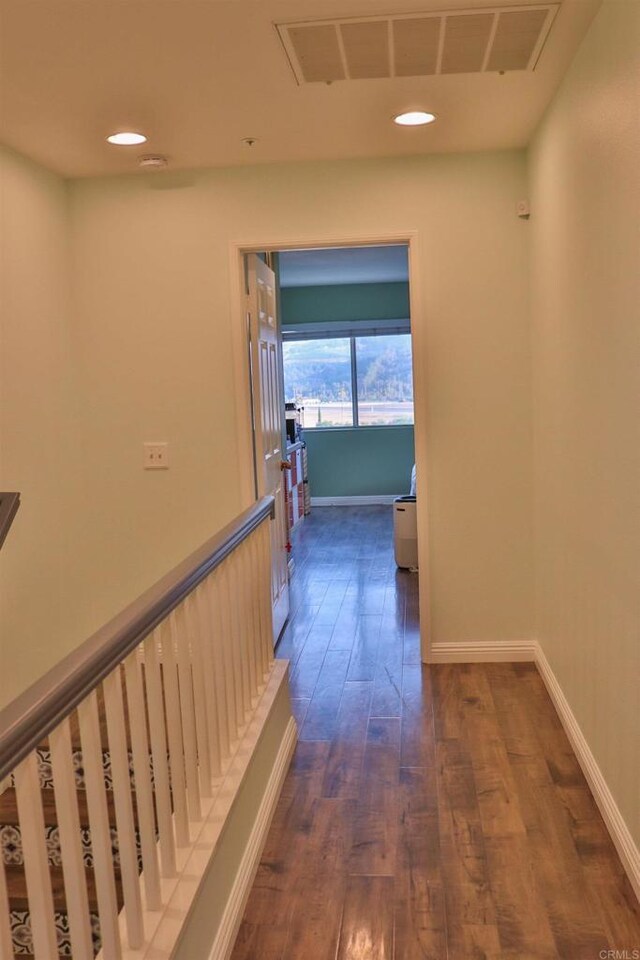 5787 Barbary Pl, Bonsall, CA 92003 - corridor with dark wood finished floors, recessed lighting, and baseboards