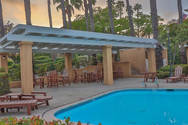 5787 Barbary Pl, Bonsall, CA 92003 - pool at dusk with a pergola, an outdoor pool, and a patio