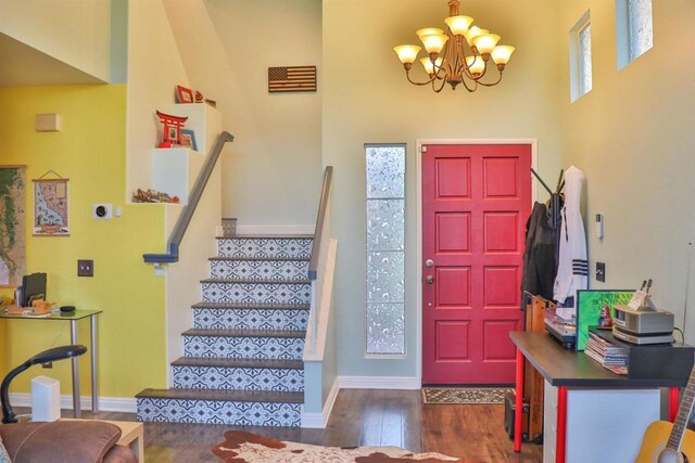 5787 Barbary Pl, Bonsall, CA 92003 - entrance foyer featuring dark wood-type flooring, a chandelier, stairway, and baseboards