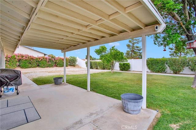 12778 Desert Creek Cir, Victorville, CA 92395 - fenced backyard with a patio area and grilling area