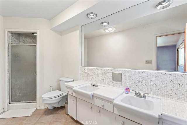 30955 Scenic Way, Running Springs, CA 92382 - bathroom with double vanity, a stall shower, toilet, and tile patterned floors