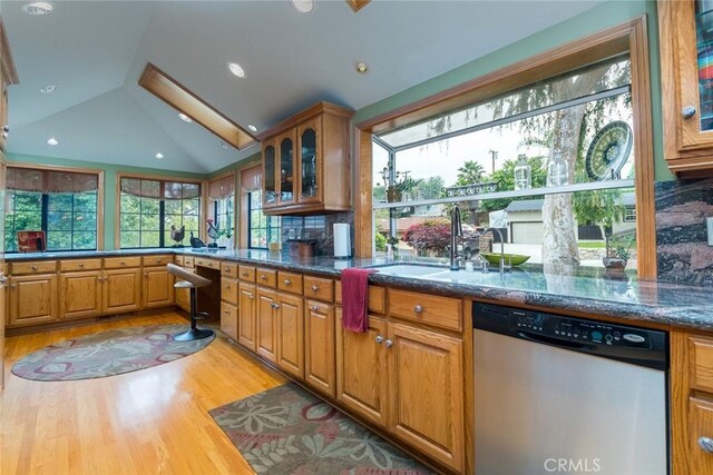 2410 W Cinco Casitas Ln, La Crescenta, CA 91214 - kitchen with stainless steel dishwasher, glass insert cabinets, light wood-style floors, lofted ceiling, and brown cabinets