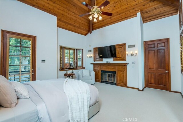 2410 W Cinco Casitas Ln, La Crescenta, CA 91214 - bedroom featuring carpet floors, a glass covered fireplace, wood ceiling, baseboards, and high vaulted ceiling