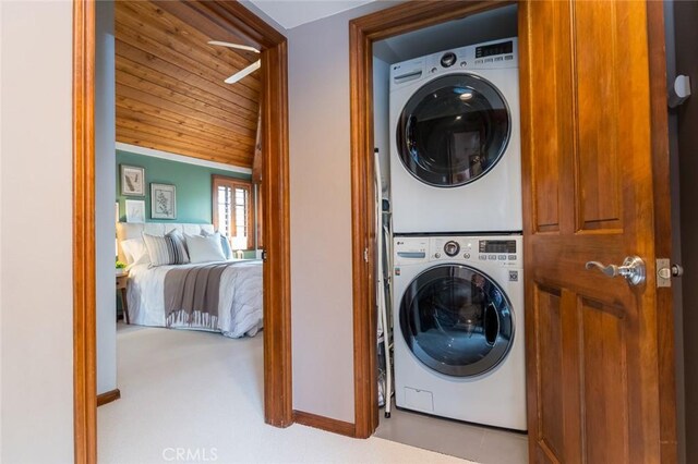 2410 W Cinco Casitas Ln, La Crescenta, CA 91214 - laundry area with stacked washer and clothes dryer, wood ceiling, and baseboards