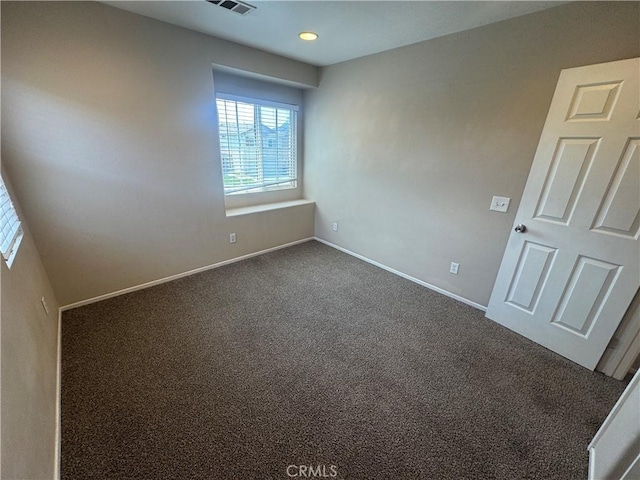 531 Corte, San Pablo, Perris, CA 92571 - empty room featuring dark colored carpet, baseboards, and recessed lighting