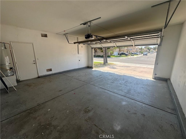 531 Corte, San Pablo, Perris, CA 92571 - garage featuring a garage door opener and baseboards