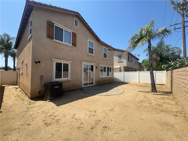 531 Corte, San Pablo, Perris, CA 92571 - back of property featuring central AC, stucco siding, and a fenced backyard