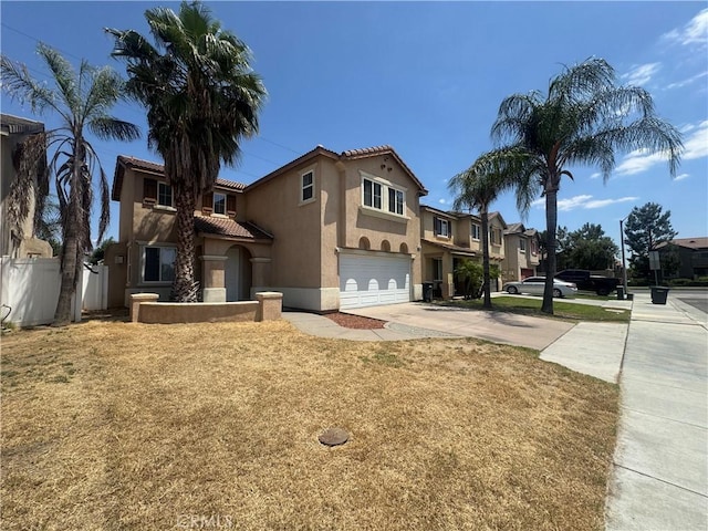 531 Corte, San Pablo, Perris, CA 92571 - mediterranean / spanish-style house with a garage, driveway, stucco siding, a tiled roof, and a residential view