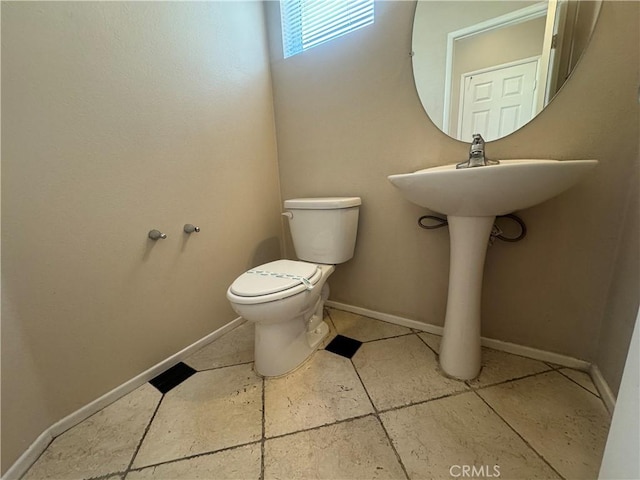 531 Corte, San Pablo, Perris, CA 92571 - half bathroom with toilet, baseboards, and tile patterned flooring