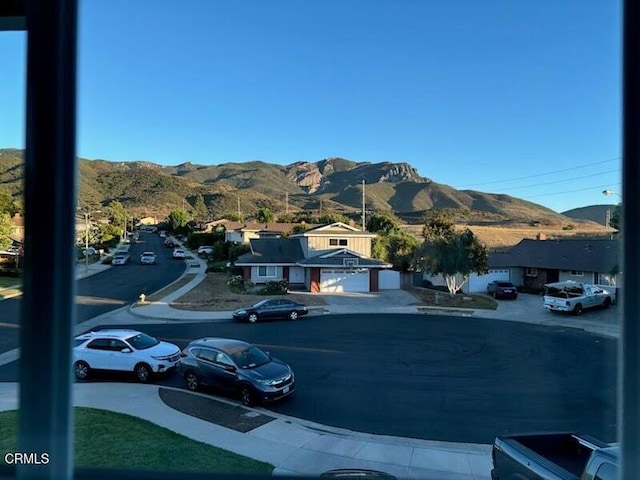 1045 Rotella St, Newbury Park, CA 91320 - view of asphalt road with a mountain view, street lights, and sidewalks