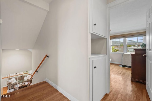 1045 Rotella St, Newbury Park, CA 91320 - staircase with wood finished floors and baseboards